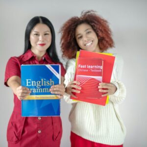 International female friends studying English language together