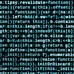 Writing programming code on laptop